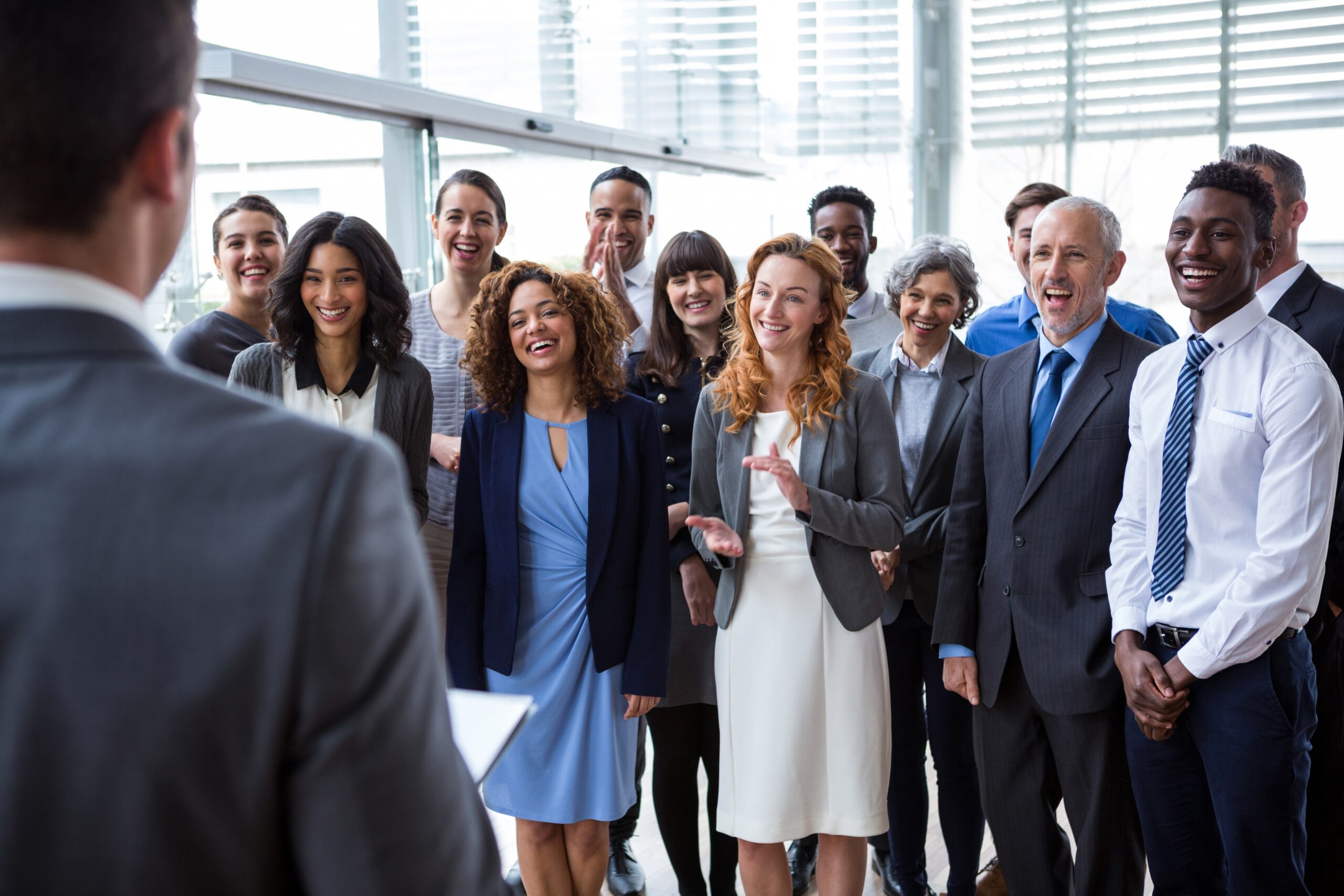 Team acknowledging a milestone, symbolizing how growth exposes pressure points in the leadership system — and how adaptive response strengthens alignment and performance.